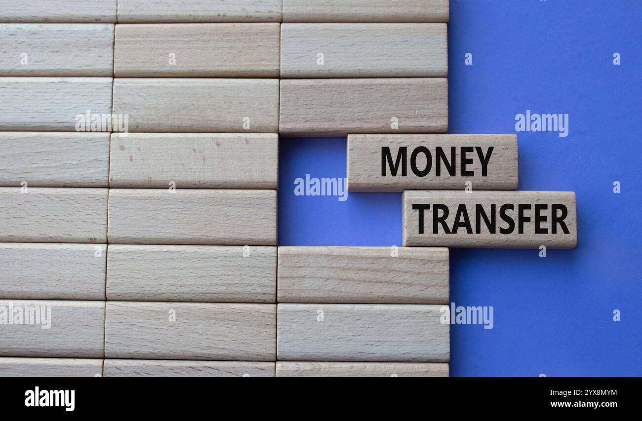 Money Transfer symbol. Concept word Money Transfer on wooden blocks ...