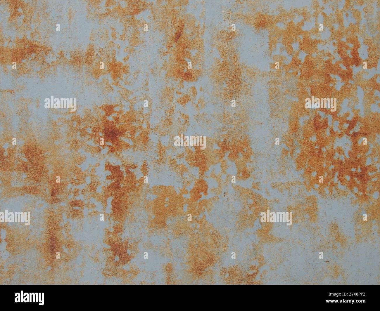 orange rust on light gray metal surface as abstract texture grunge background, metal corrosion fragment of iron sheet Stock Photo
