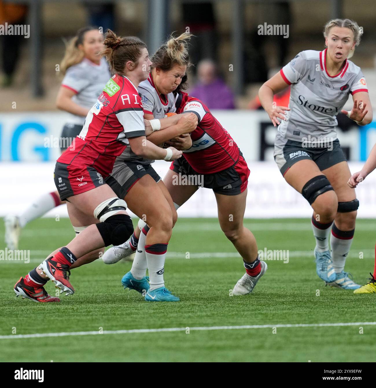 Gloucester,UK,  14 Dec 2024  Marlie Packer of Saracens (C) is tackled during the Premiership Womens Rugby Gloucester Hartpury v Saracens at Kingsholm Stadium Gloucester United Kingdom on December 14 2024 Graham Glendinning / Alamy Live News Stock Photo