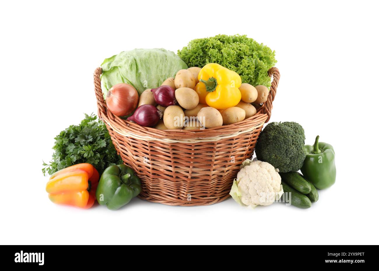 Different ripe vegetables in wicker basket isolated on white Stock ...