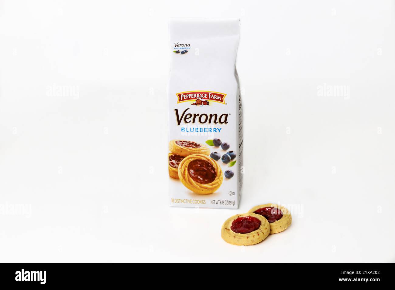 Blueberry cookies in packaging with two cookies beside, showcasing sweet snack perfect for anytime enjoyment Stock Photo