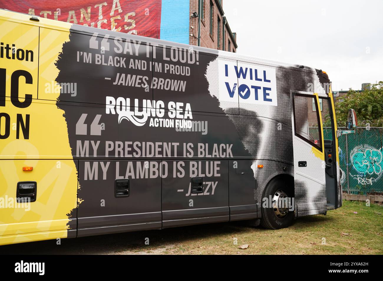 A promotional bus for the Black Music Action Coalition featuring quotes from James Brown and Jeezy is seen during a Team Harris Walz event at the Atlanta Influences Everything brand headquarters on November 1, 2024 in Atlanta, Georgia, USA. (Photo by Julia Beverly/Alamy Live News) Stock Photo