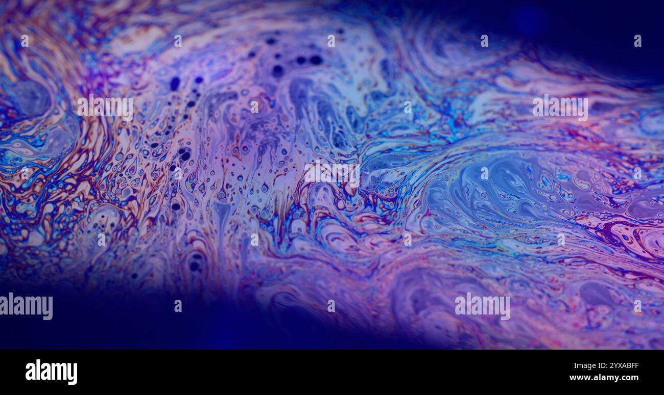 Psychedelic fantasy. Dye mixing. Defocused multicolor purple green ...