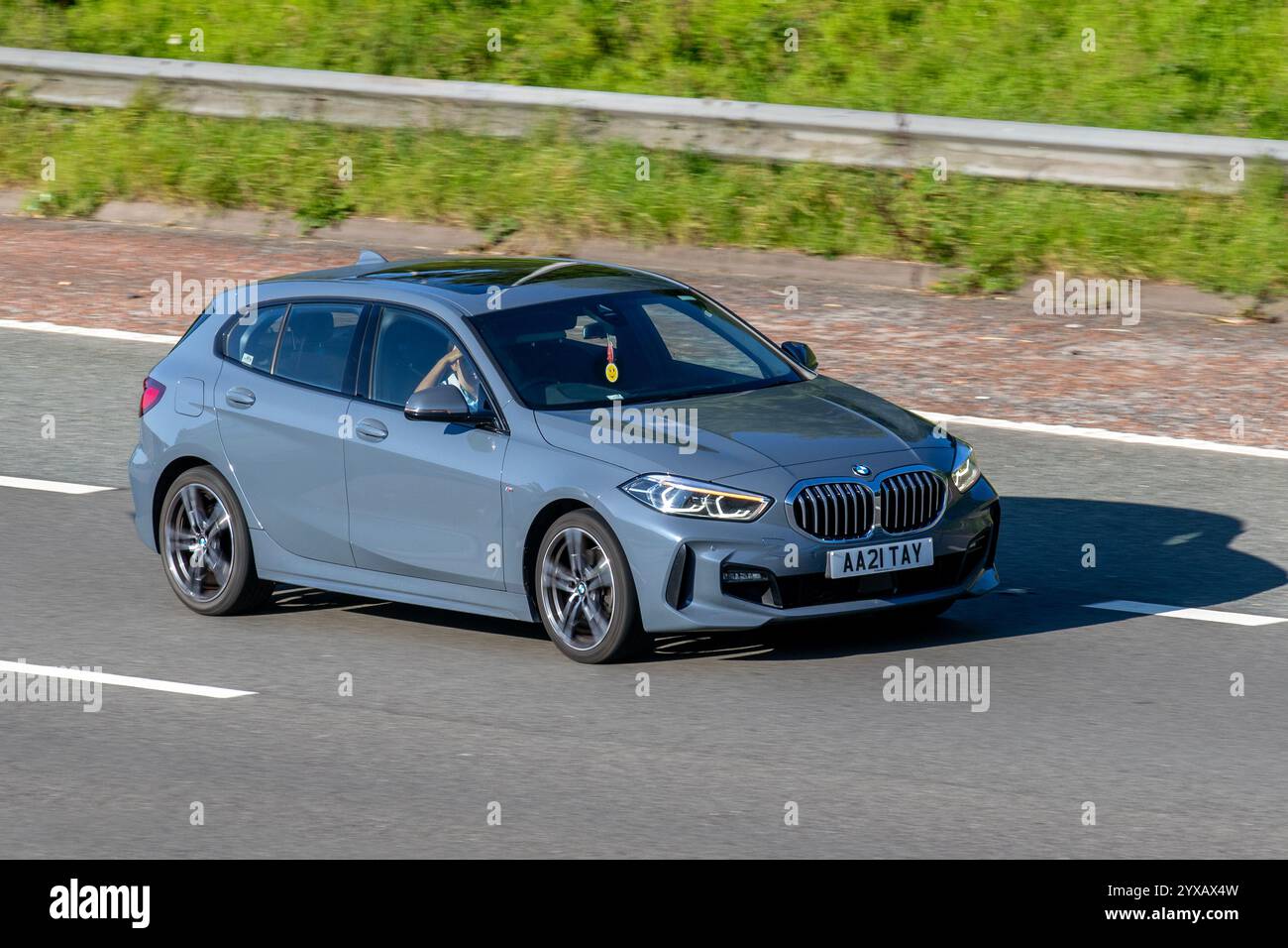 2024 Portimao Blue BMW I4 Edrive35 M Sport. 286 Electric 70.2Kwh Auto Hatchback Electricity 210 kW; travelling on the M6 motorway, UK Stock Photo