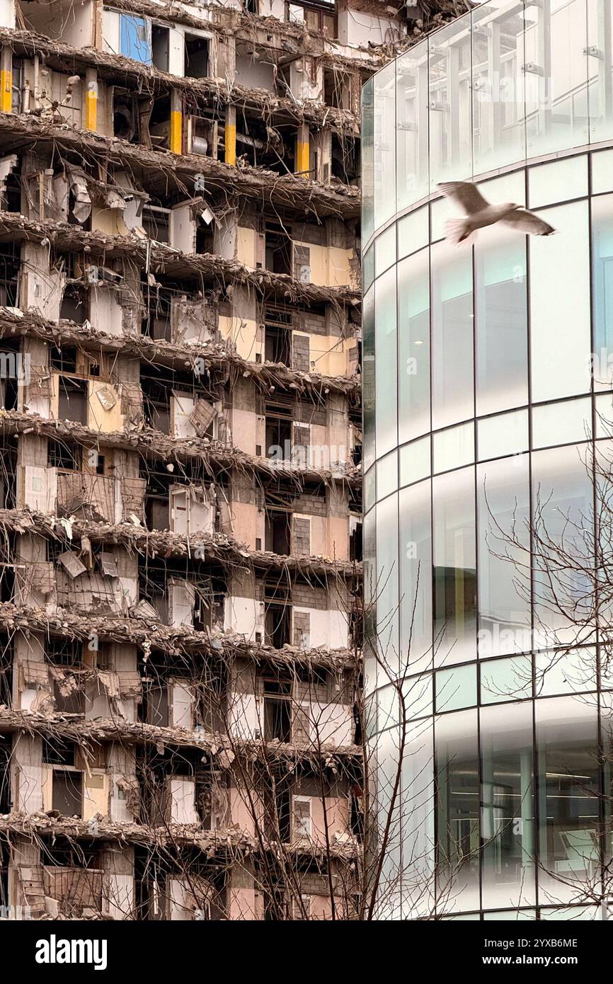 Demolition of the old Royal Liverpool Hospital contrasted against modern architecture (Clatterbridge Cancer centre) - Smartphone Captured Stock Image