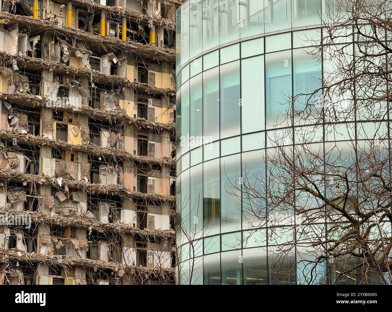 Demolition of the old Royal Liverpool Hospital contrasted against modern architecture (Clatterbridge Cancer centre) - Smartphone Captured Stock Image