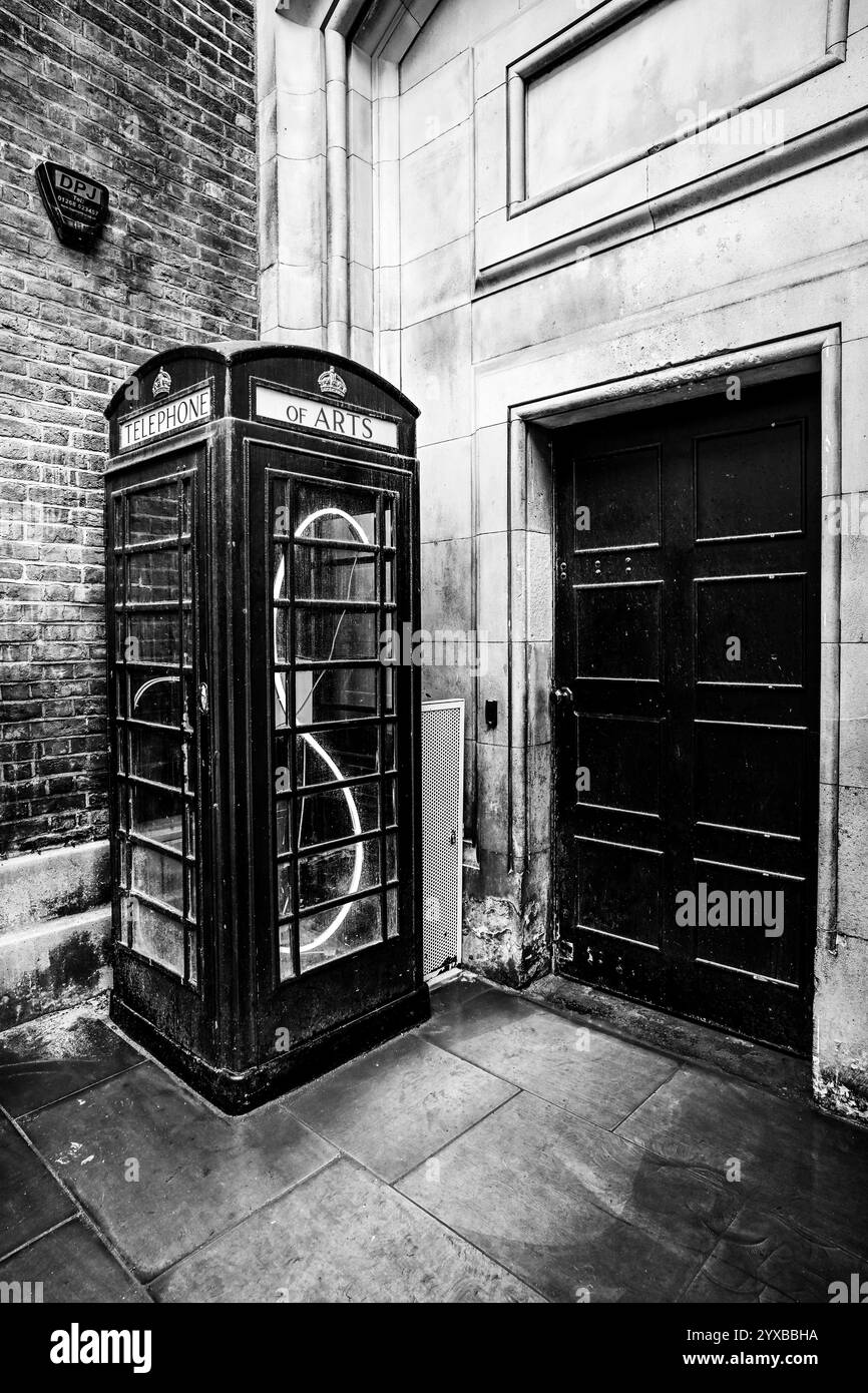 Black public telephone box Black and White Stock Photos & Images - Alamy