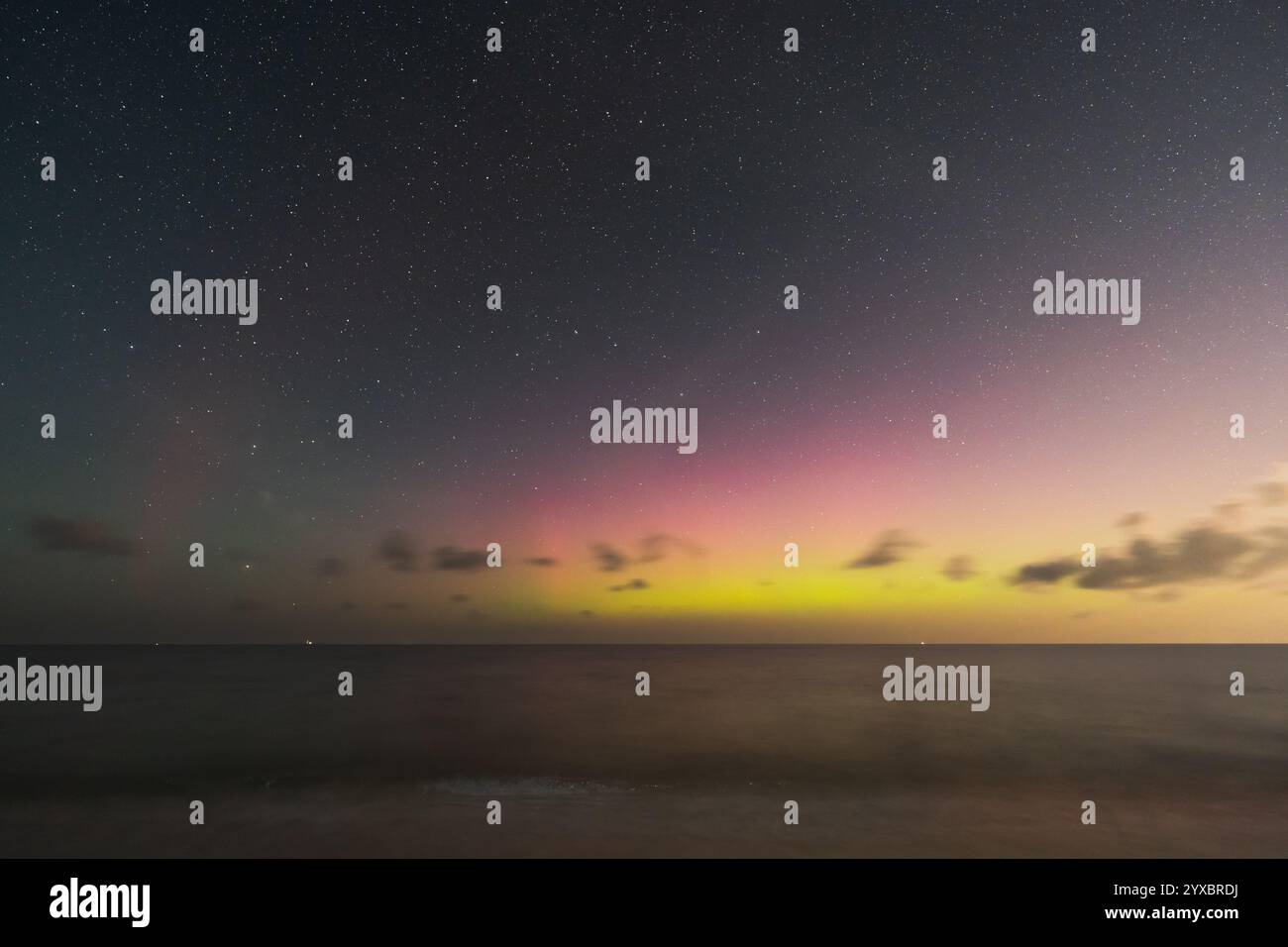 A breathtaking view of the aurora borealis dancing over a tranquil ...