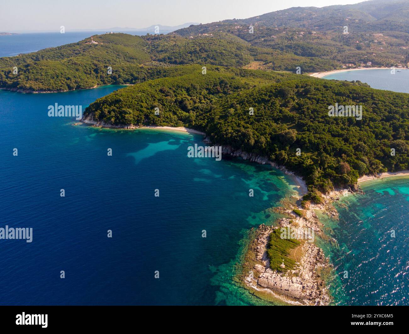 Aerial view of lush green islands meeting turquoise waters Stock Photo ...