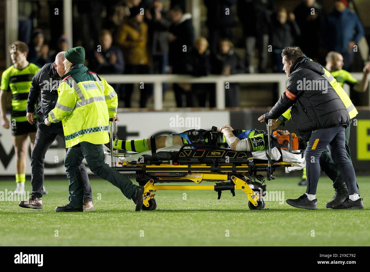Dragons George Nott is stretched off during the EPCR Challenge Cup ...