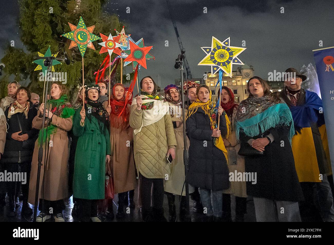 London, UK. 15th December 2024. Ukrainian Christmas carols in Trafalgar Square. British-Ukrainians in traditional festive dress near the recently installed Norwegian Christmas spruce tree to sing carols. Currently in its ninth year, the Ukrainian carol event is organised by British-Ukrainian Aid aiming to further raise donations towards the purchase of generators and medical aid to Ukrainian hospitals and shelters. Credit: Guy Corbishley/Alamy Live News Stock Photo