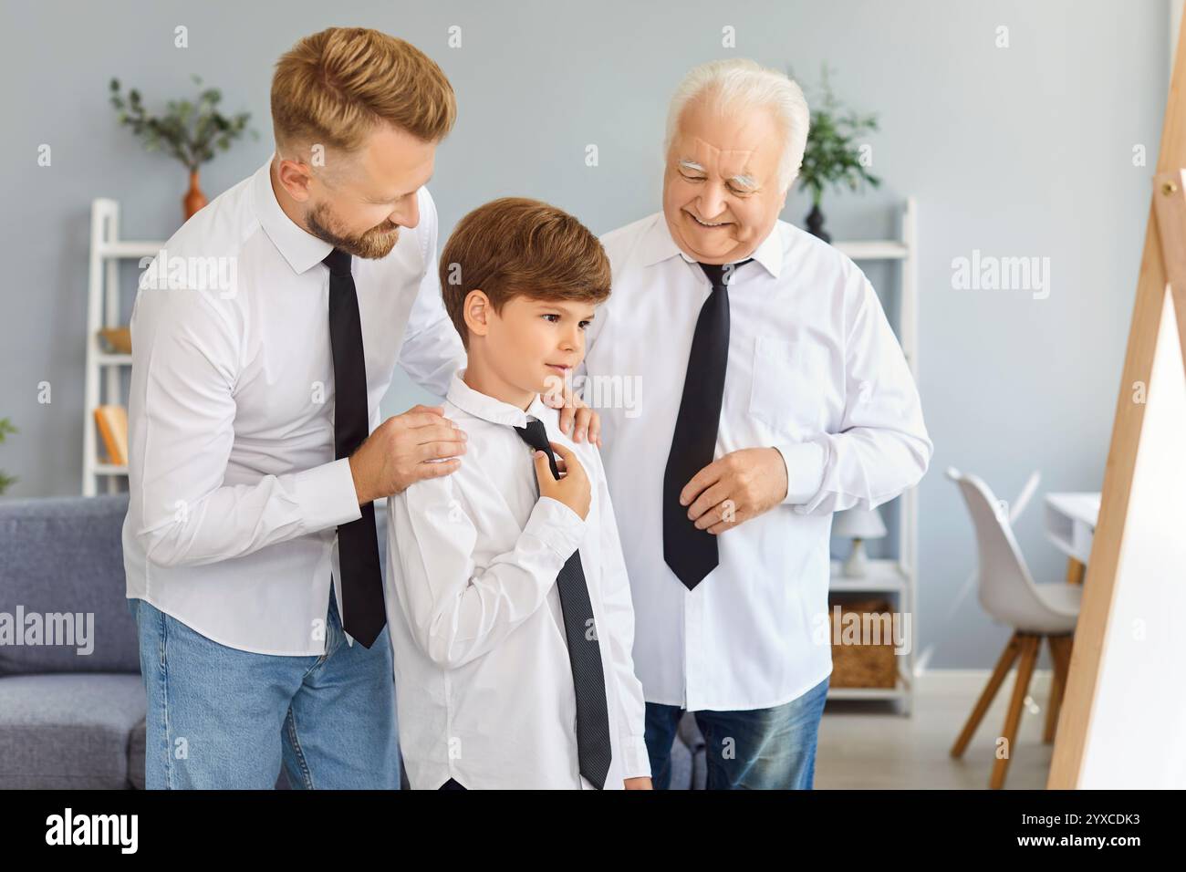 Happy father, grandfather and child boy in shirts and ties getting ...