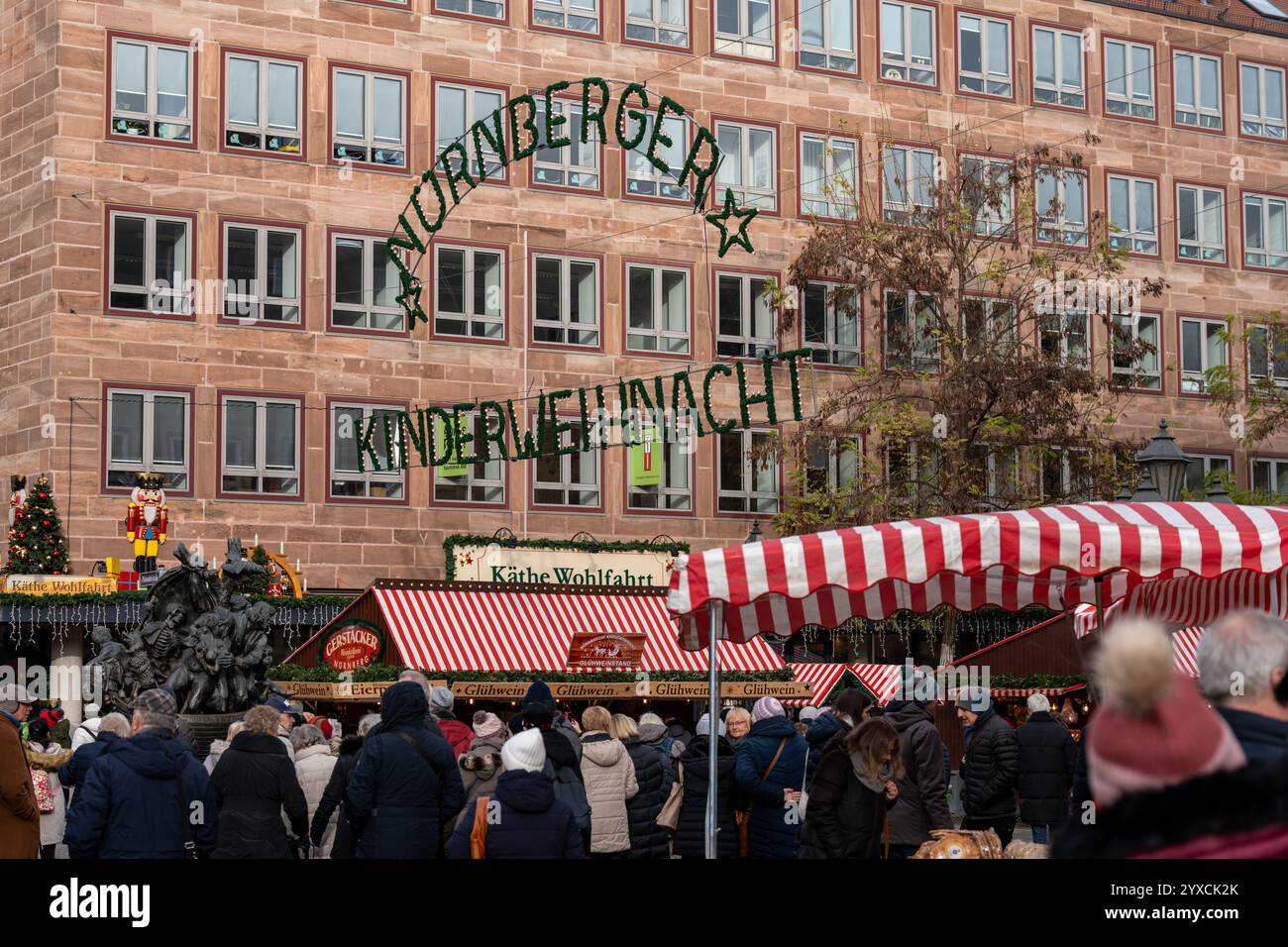 Nuremberg, Germany - December 4, 2024: People explore the famous Christmas market at Nuremberg's Christkindlesmarkt one of Germany's oldest dating bac Stock Photo