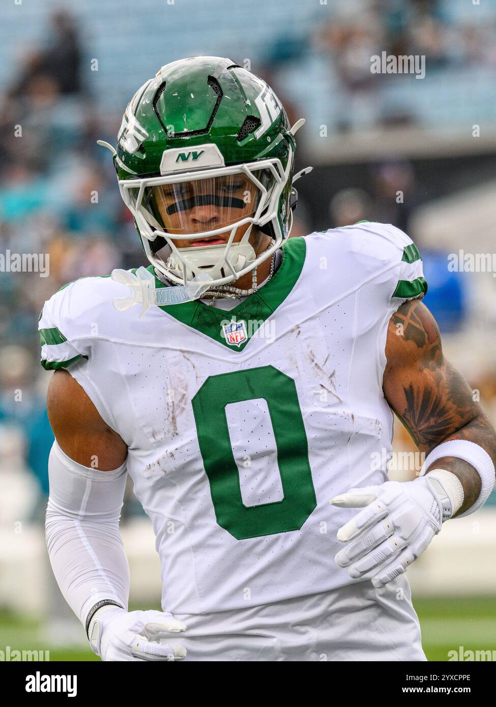 Jacksonville, FL, USA. 15th Dec, 2024. New York Jets running back Braelon Allen (0) warms up before a game against the Jacksonville Jaguars in Jacksonville, FL. Romeo T Guzman/Cal Sport Media/Alamy Live News Stock Photo