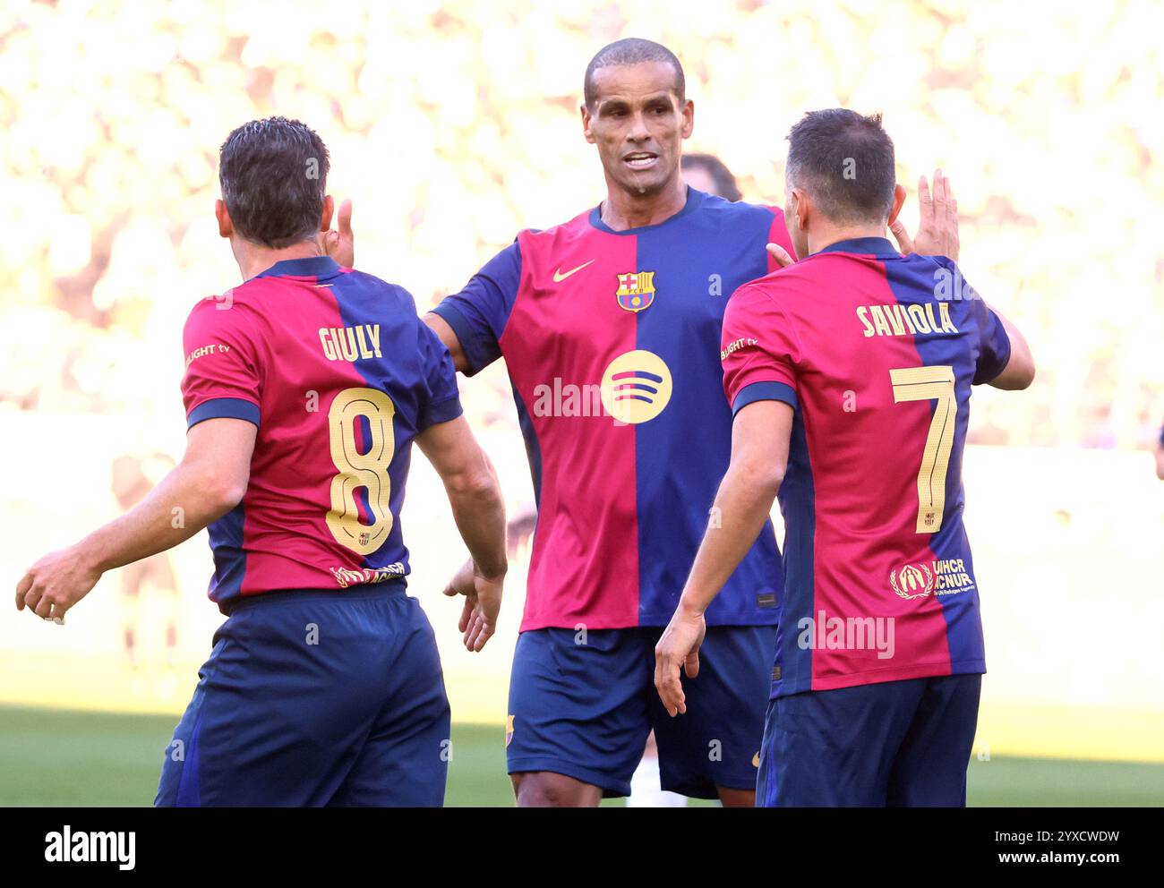 FC Barcelona player Javier Saviola, left, celebrates his goal