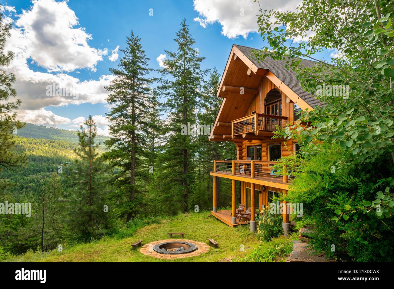 An upscale log home with fire pit overlooking in a private location in ...