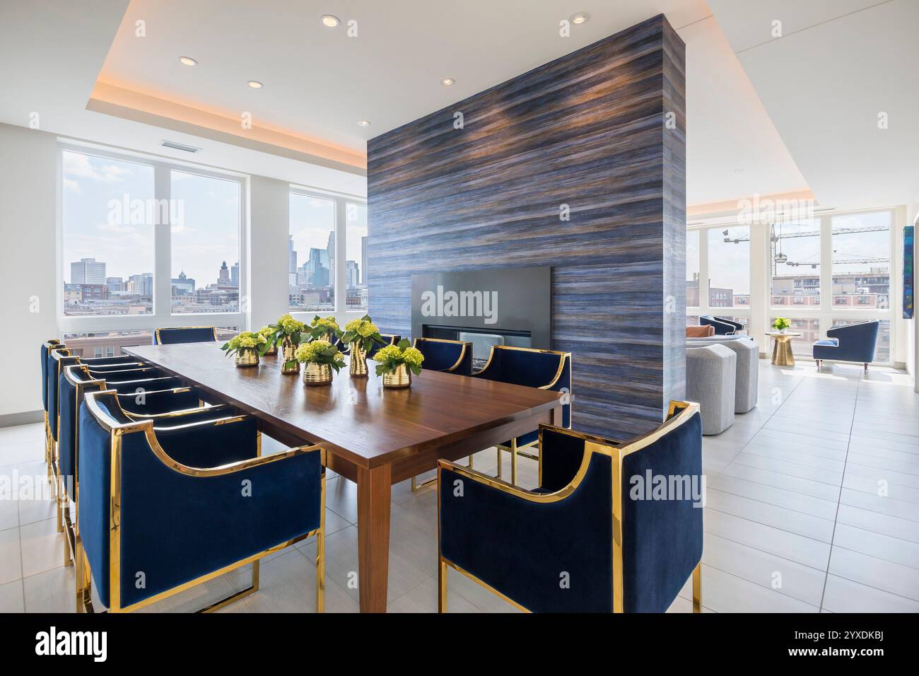 Upper floor lounge in new apartment building showing long table next to ... - Resident Lounge In High-Rise Building