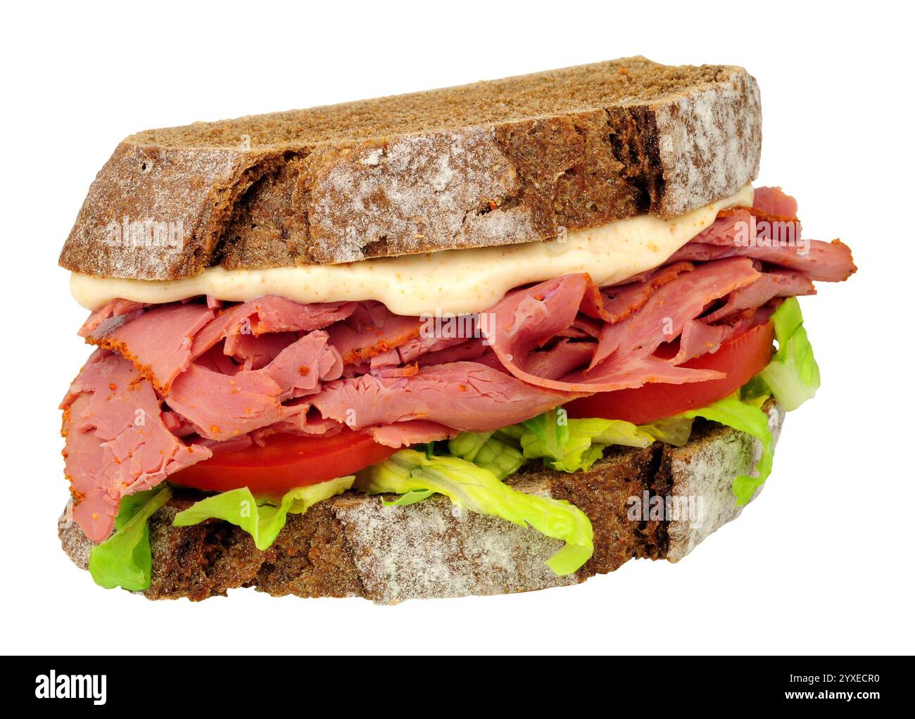 Pastrami and salad sandwich in sliced German style crusty sourdough rye ...
