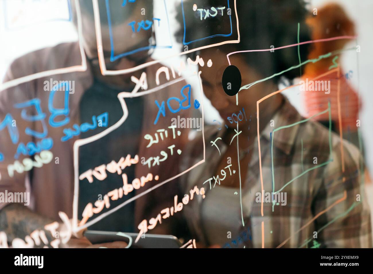 Portrait of african american female IT developer, programmer, designer working with programming code Stock Photo