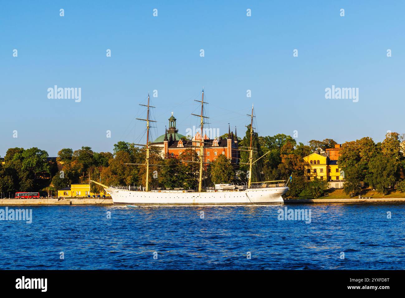 View over Stockholm Strom to floating hotel ship af Chapman on Skeppsholmen, from Gamla Stan, the old town of Stockholm, capital city of Sweden Stock Photo
