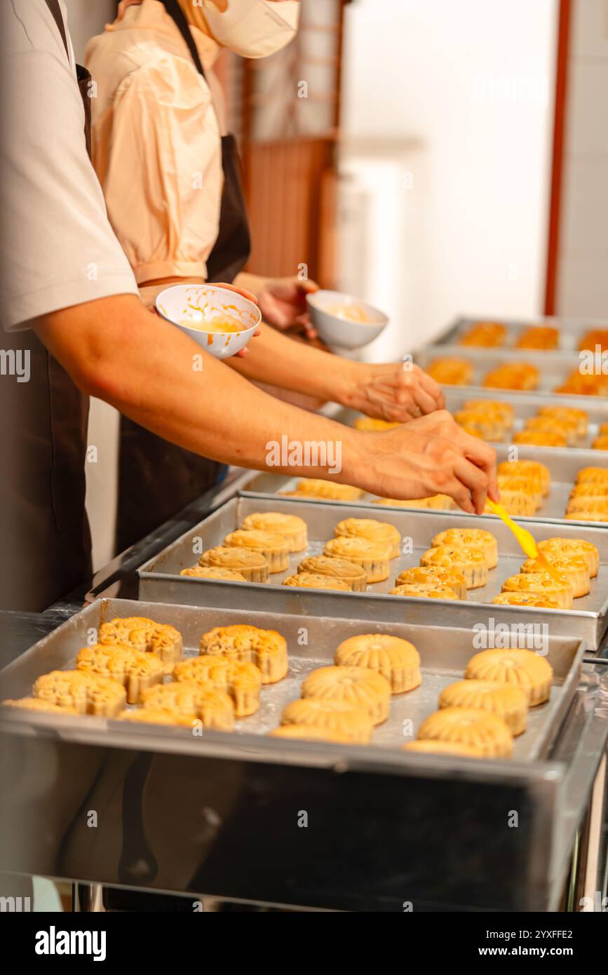 Mooncake making process. A mooncake is a Chinese bakery product ...