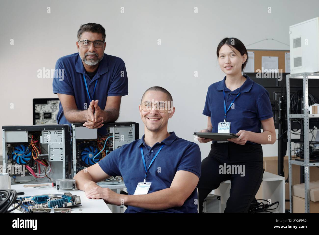 Team of IT Technicians Collaborating in Office Stock Photo