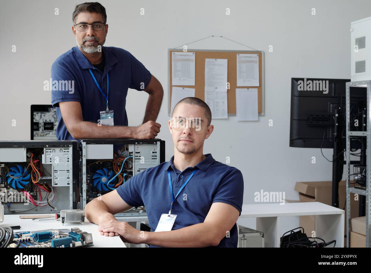 Portrait of Computer Technicians Examining Hardware Components Stock ...