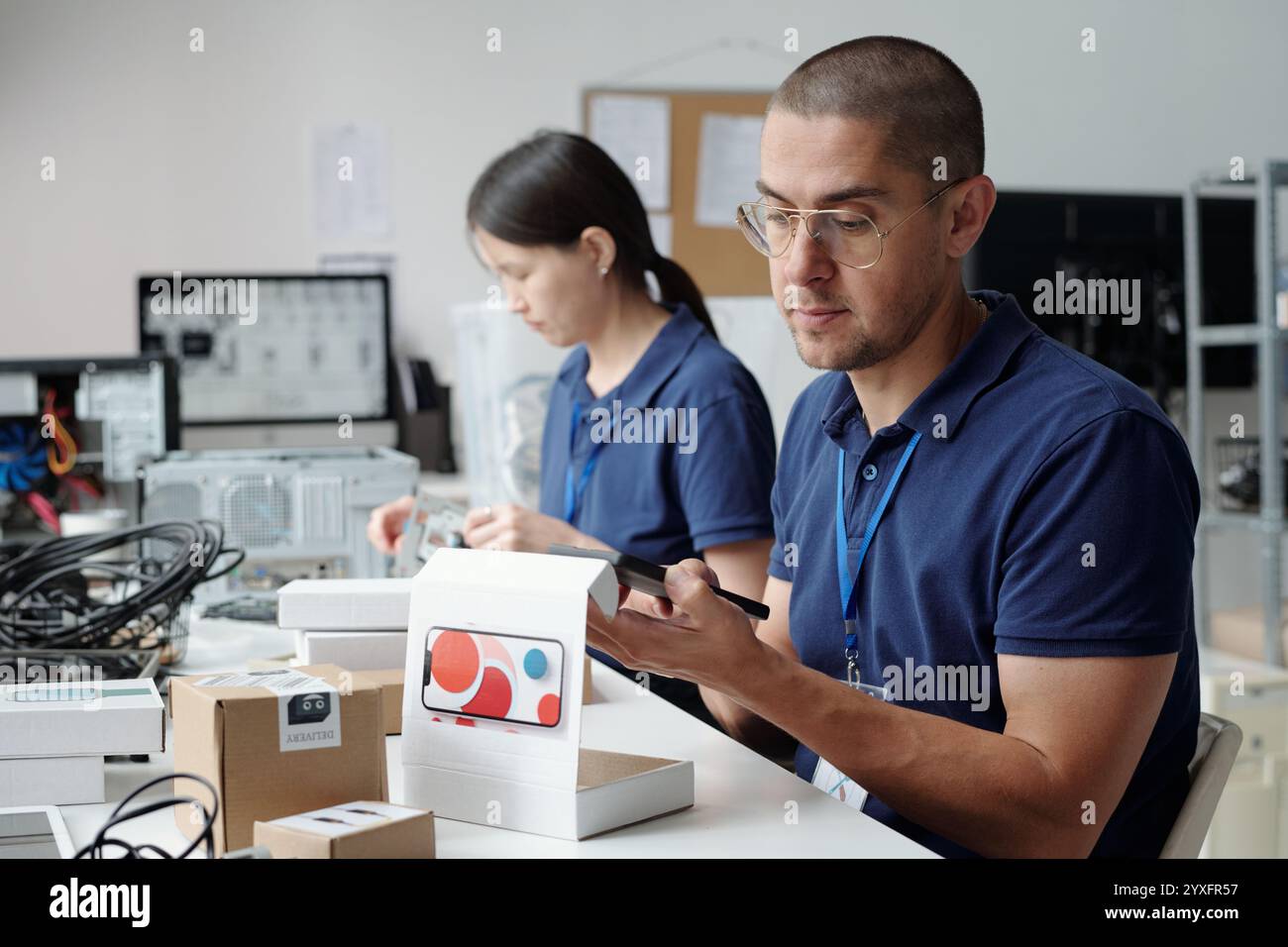 Collaborating on Technology Projects in Office Setting Stock Photo