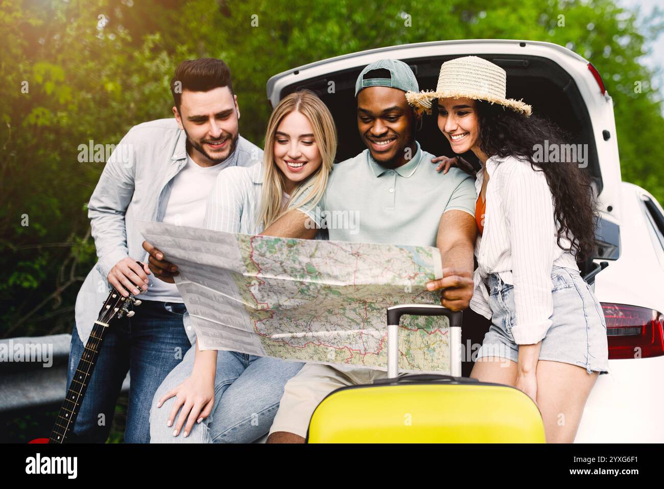 traveling-with-friends-happy-multiracial-young-people-sitting-in-open