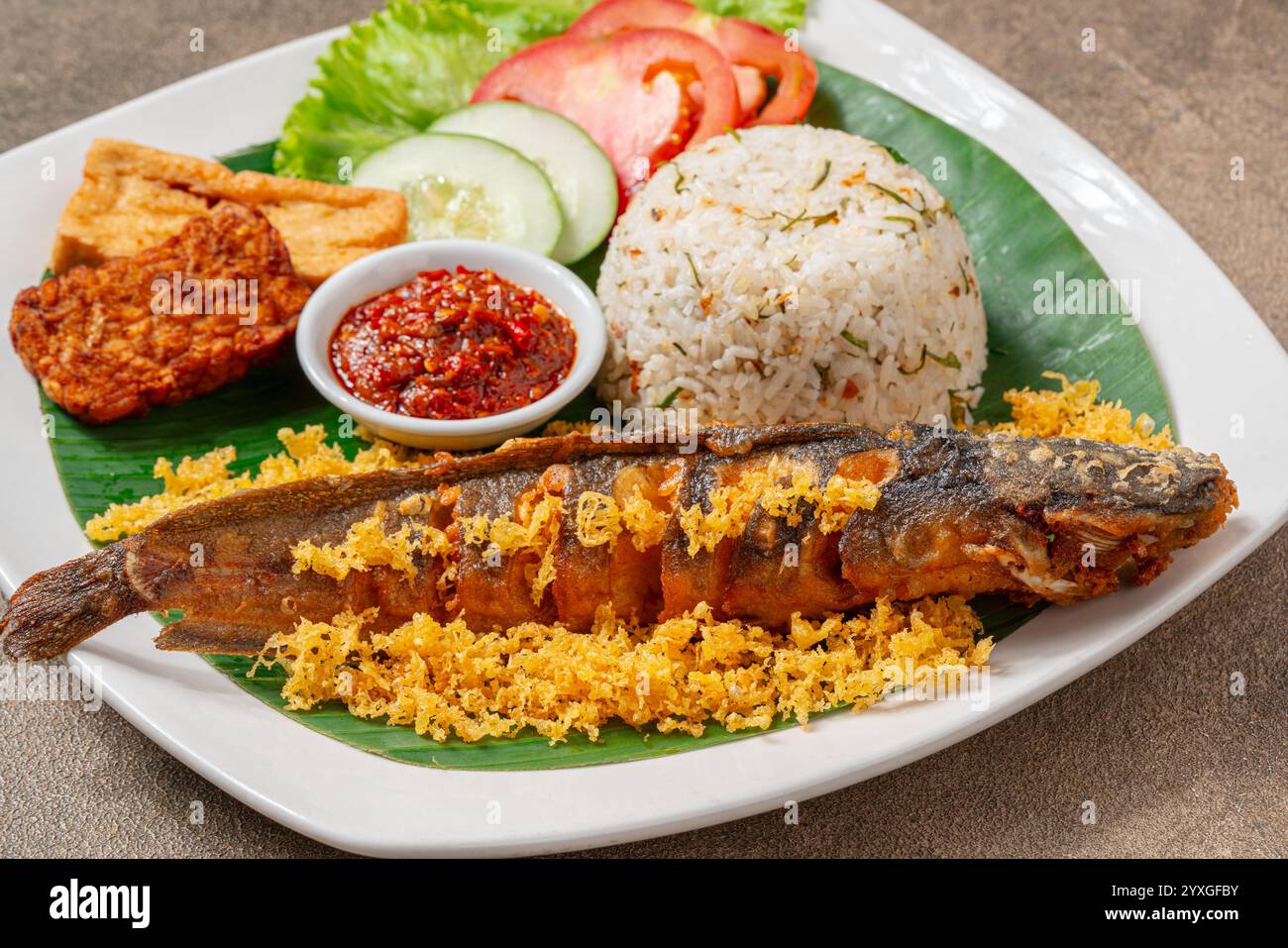 Fried Catfish (Indonesia : lele goreng) with sambal balado is Traditional Indonesian Culinary Food, Popular Street Food Called Pecel Lele Lamongan or Stock Photo