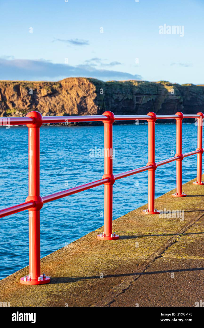 Shiny new red railings on West Pier in the harbour at Eyemouth ...