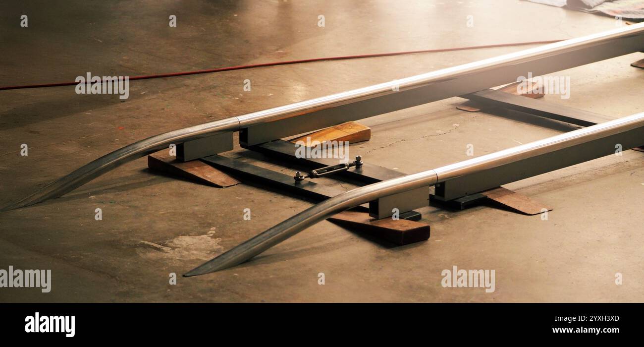 Camera trolley or camera dolly cart rails for filmmaking on studio shooting set. Pro videographer dolly rail track for filming movie mounted on studio Stock Photo