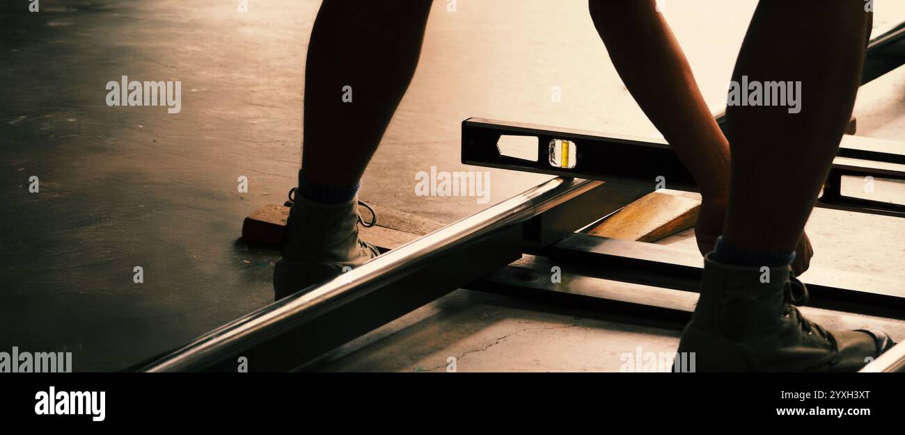 Camera trolley or camera dolly cart rails for filmmaking on studio shooting set. Pro videographer dolly rail track for filming movie mounted on studio Stock Photo