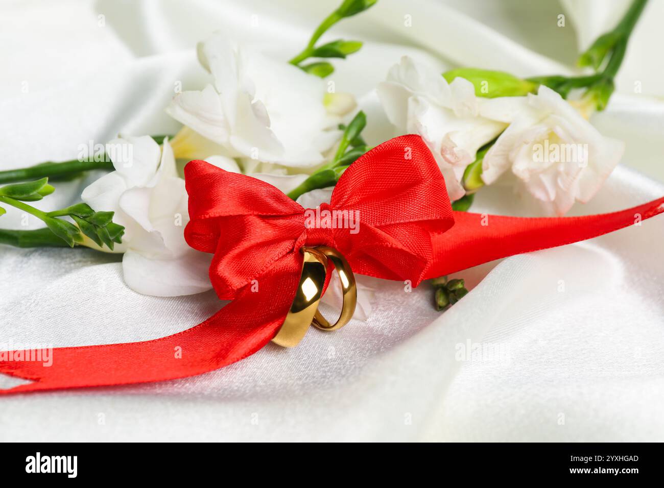Wedding decoration rings red ribbon hi-res stock photography and images ...