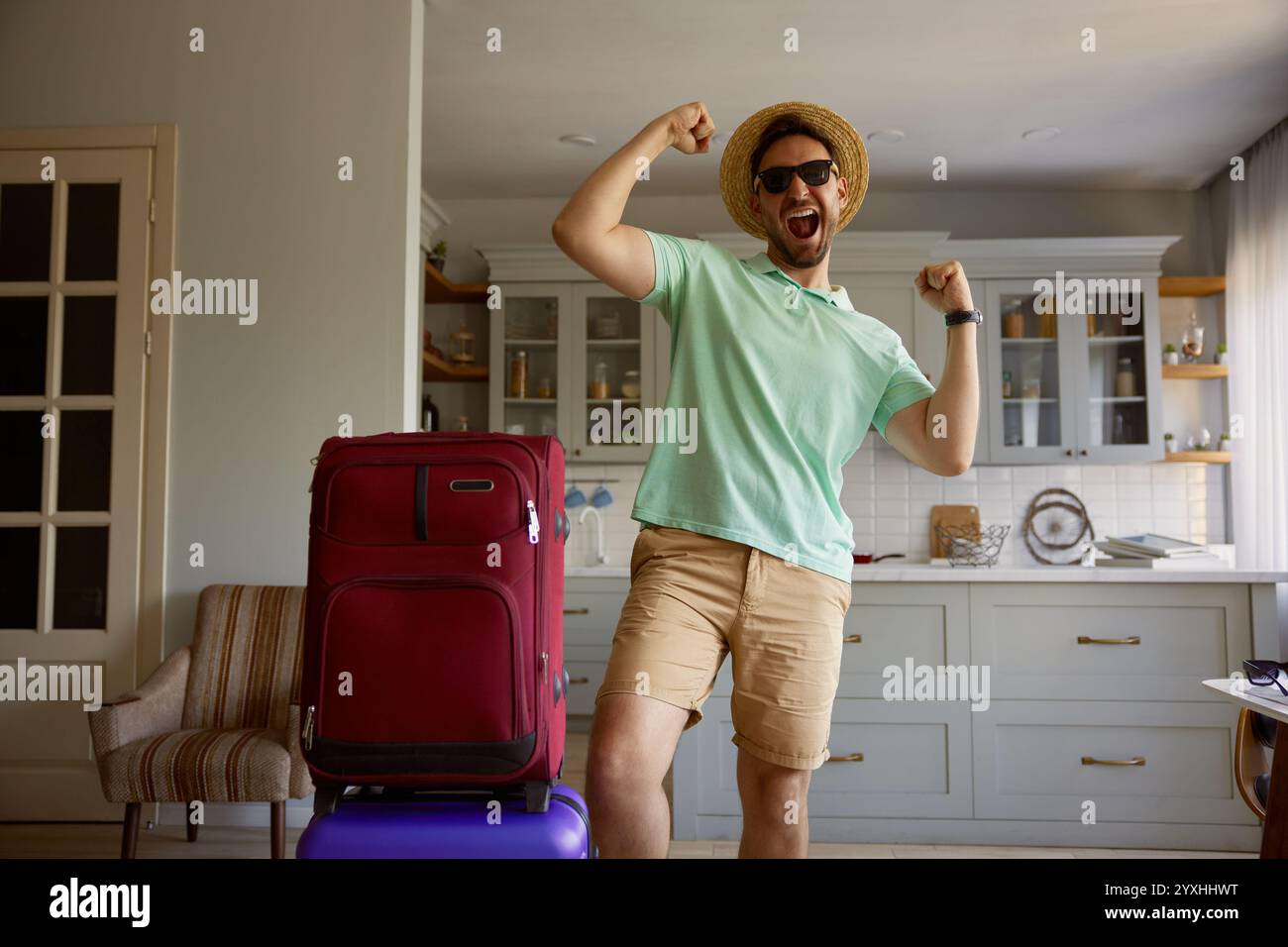 Happy man tourist with packed luggage suitcases Stock Photo