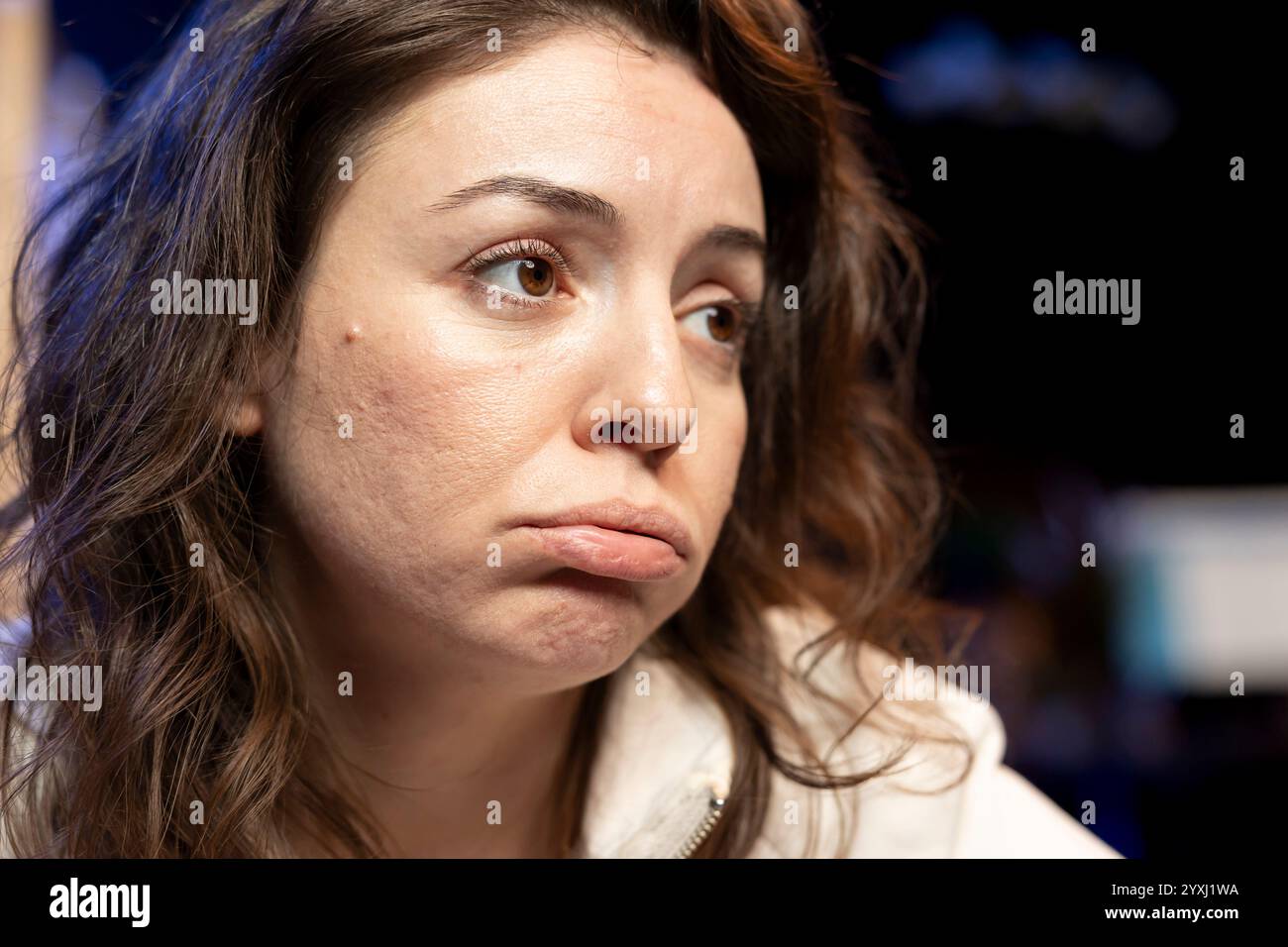 Computer scientist pouting while doing software quality assurance, finding major errors in source code. Close up of sad technician upset after inspecting coding on computer and seeing many issues Stock Photo