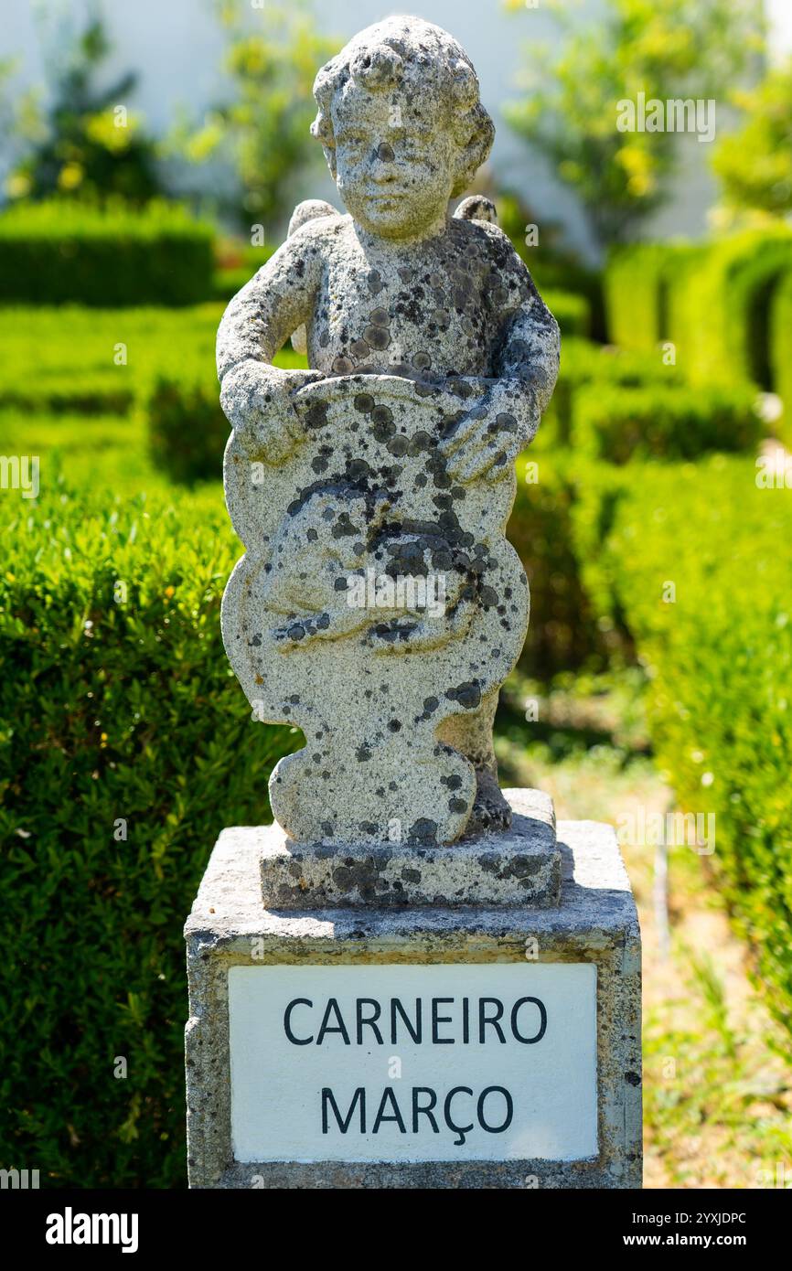 Stone statue depicting the ram sign belonging to the episcopal garden ...