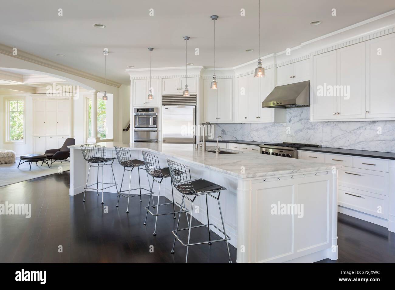 Kitchen Angled View Large white kitchen with angled floor plan that leads toward family ...