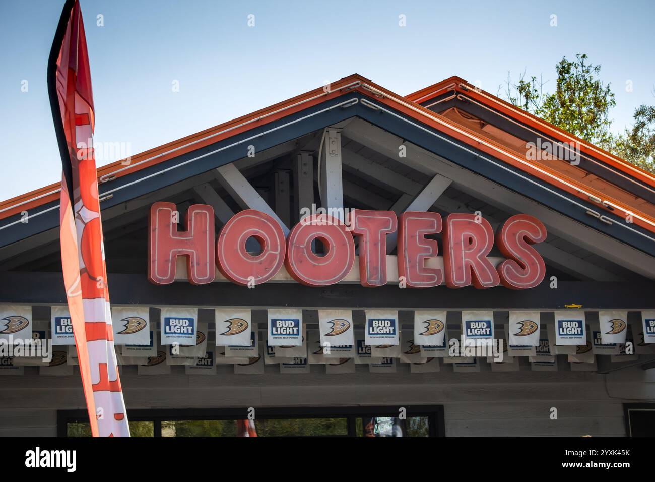 Anaheim, California, United States - 03-25-2019: A view of a store front sign for the adult themed restaurant known as Hooters. Stock Photo