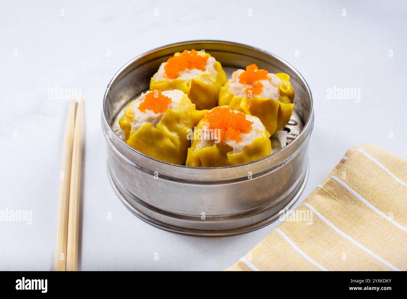 A view of a steamer container of shu mai. Stock Photo