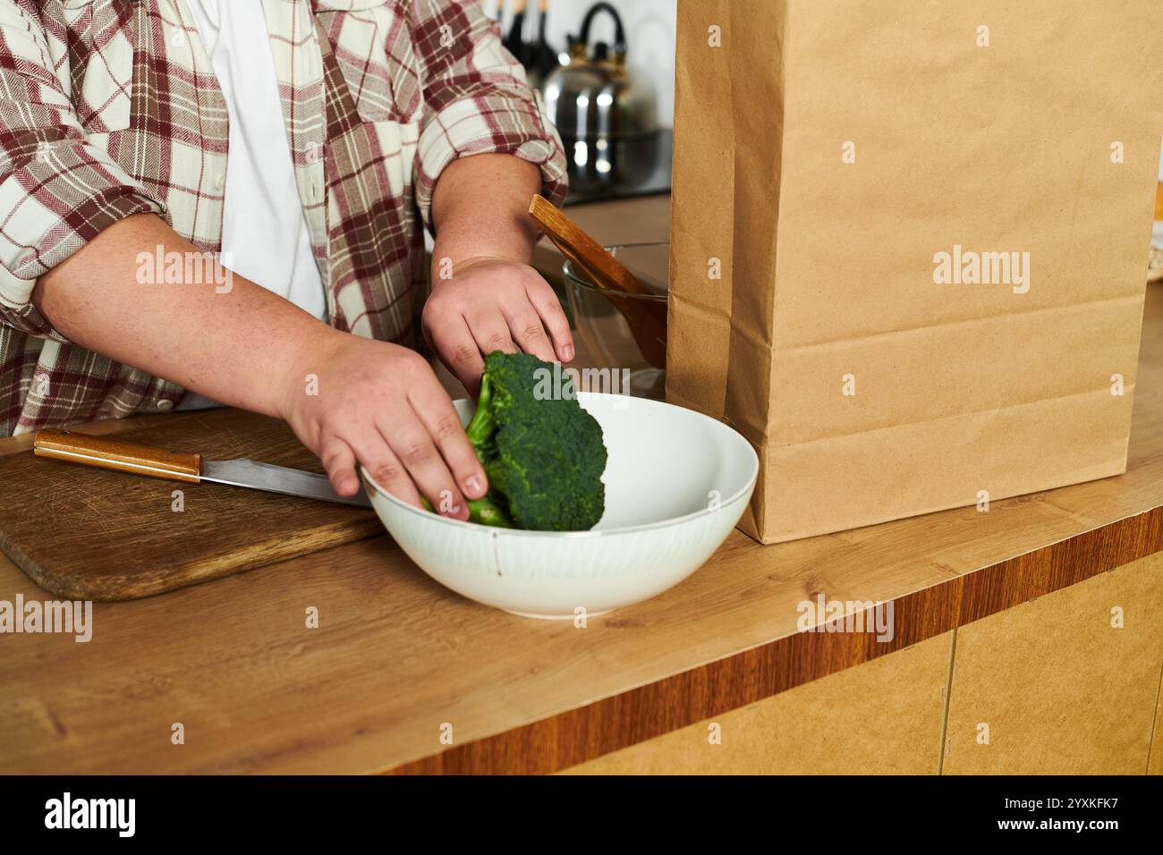 Woman prepares broccoli cooking in hi-res stock photography and images ...