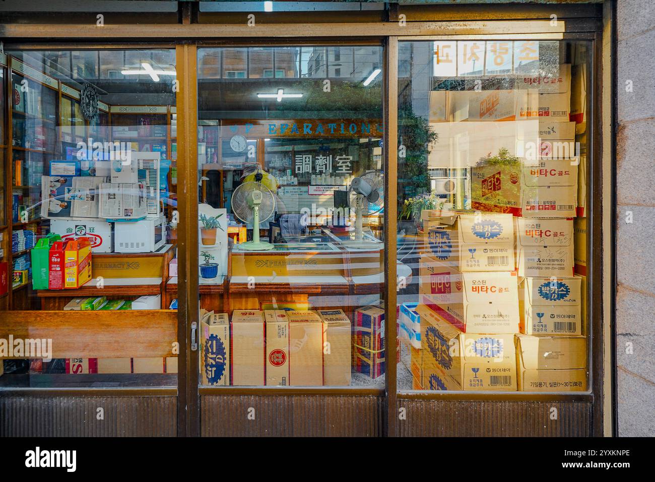 The showcase window of an old pharmacy in Busan, South Korea, displaying vintage charm and a glimpse into the city's history. Stock Photo