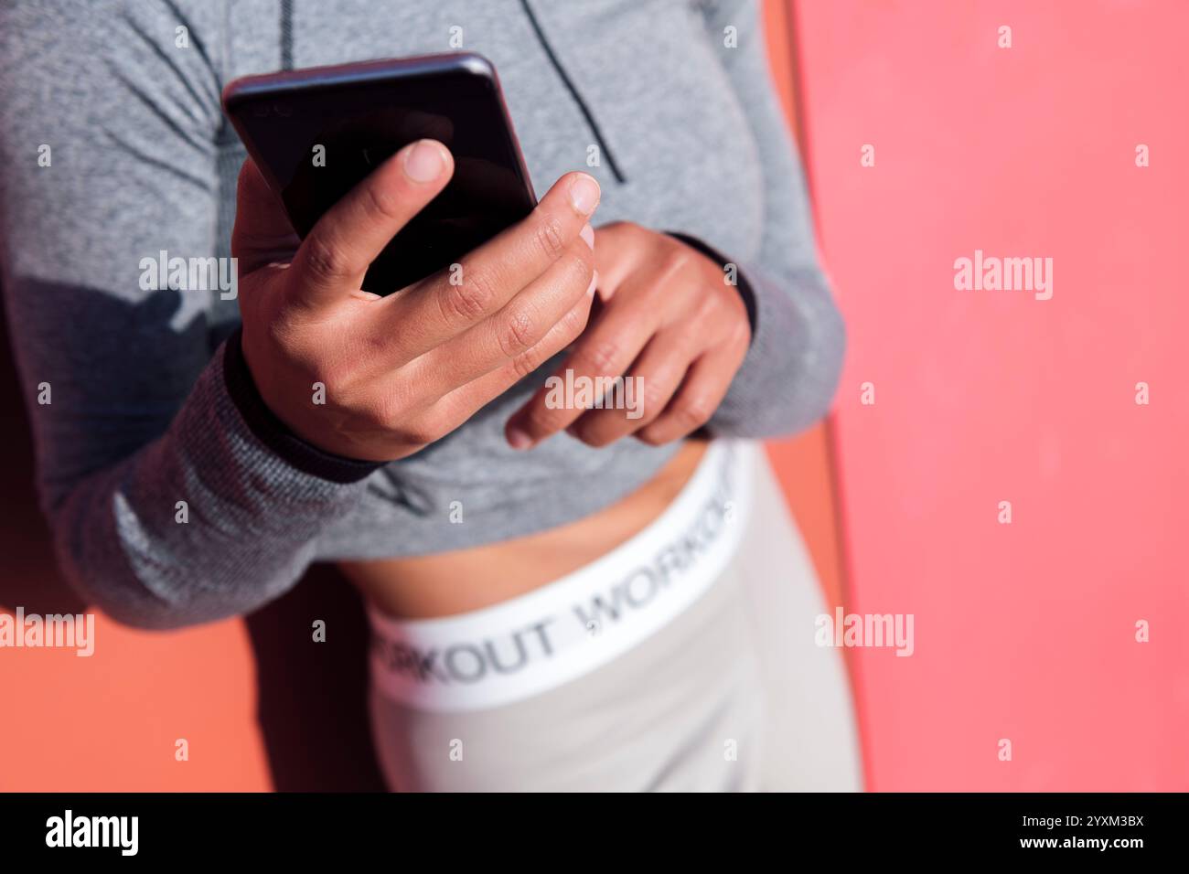 close up of an anonymous woman using cellphone Stock Photo