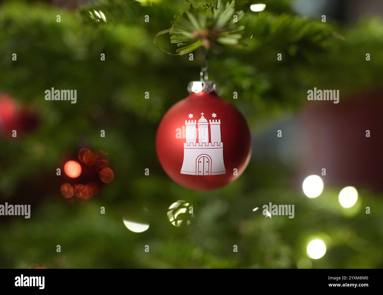 Hamburg, Germany. 16th Dec, 2024. A red Christmas tree bauble with the coat of arms of Hamburg hangs on a festively decorated Christmas tree in the mayor's office in the town hall. Credit: Marcus Brandt/dpa/Alamy Live News Stock Photo