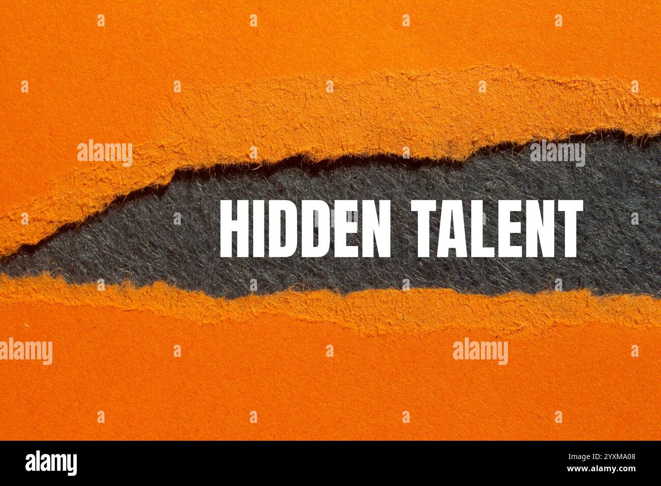 Hidden talent message written on ripped torn orange paper with gray