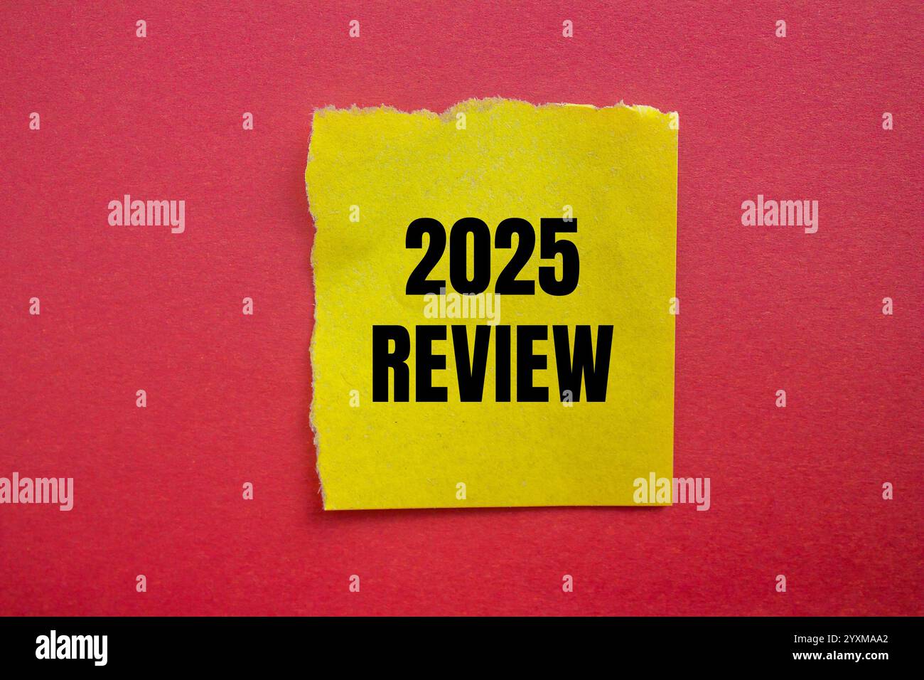 2025 Review Message Written On Ripped Torn Yellow Paper Piece With Red 2025 Review Message Written On Ripped Torn Yellow Paper Piece With Red