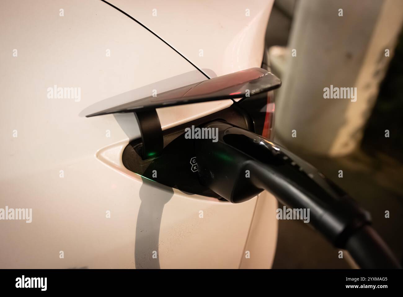 Electric Vehicle Charging in Progress Stock Photo