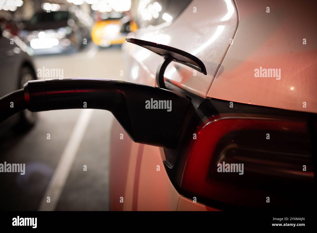 Electric Vehicle Charging at Supercharger Stock Photo