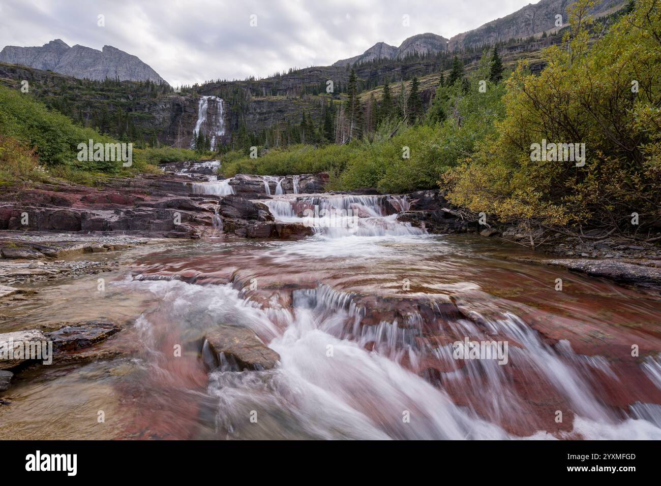 Pyramid Peak Creek waterfalls, near Mokowanis Lake, Glacier National Park, Montana, USA Stock Photo