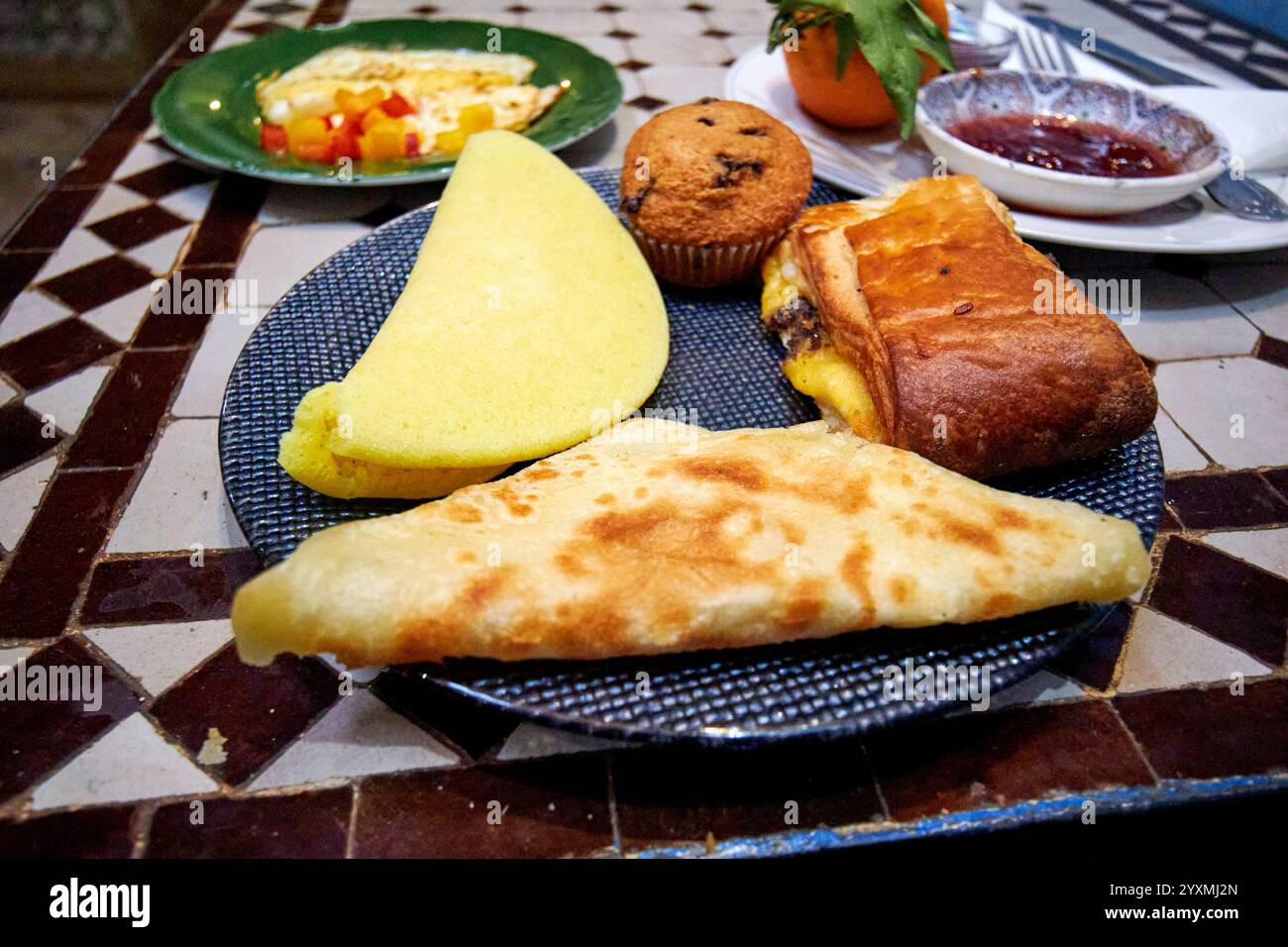 moroccan pancakes and pastries as part of breakfast at a riad marrakesh, morocco Stock Photo